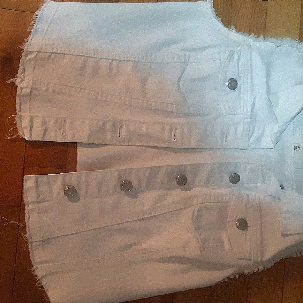 Jean vest. Frayed at the bottom and sleeves